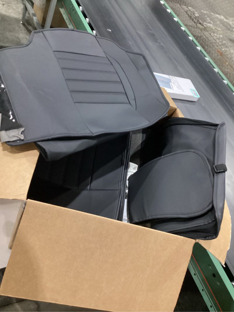 Condition photo showing Good Condition for black seat covers, 4 seat covers in box