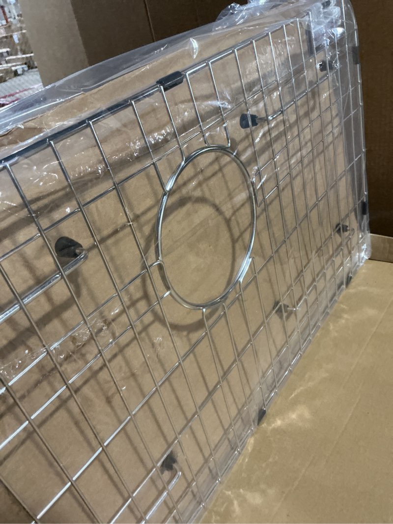 Condition photo showing Good Condition for stainless steel sink grid and protectors for bottom of kitchen sink, 26" x 14 1/16" sink bottom grid with rear drain for single sink bowl (26" x 14 1/16") 26" x 14 1/16" rear drain