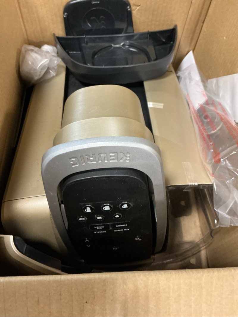 Condition photo showing As Is for keurig k-elite single serve k-cup pod coffee maker, with strength and temperature control, iced coffee capability, 8 to 12oz brew size, programmable, brushed gold