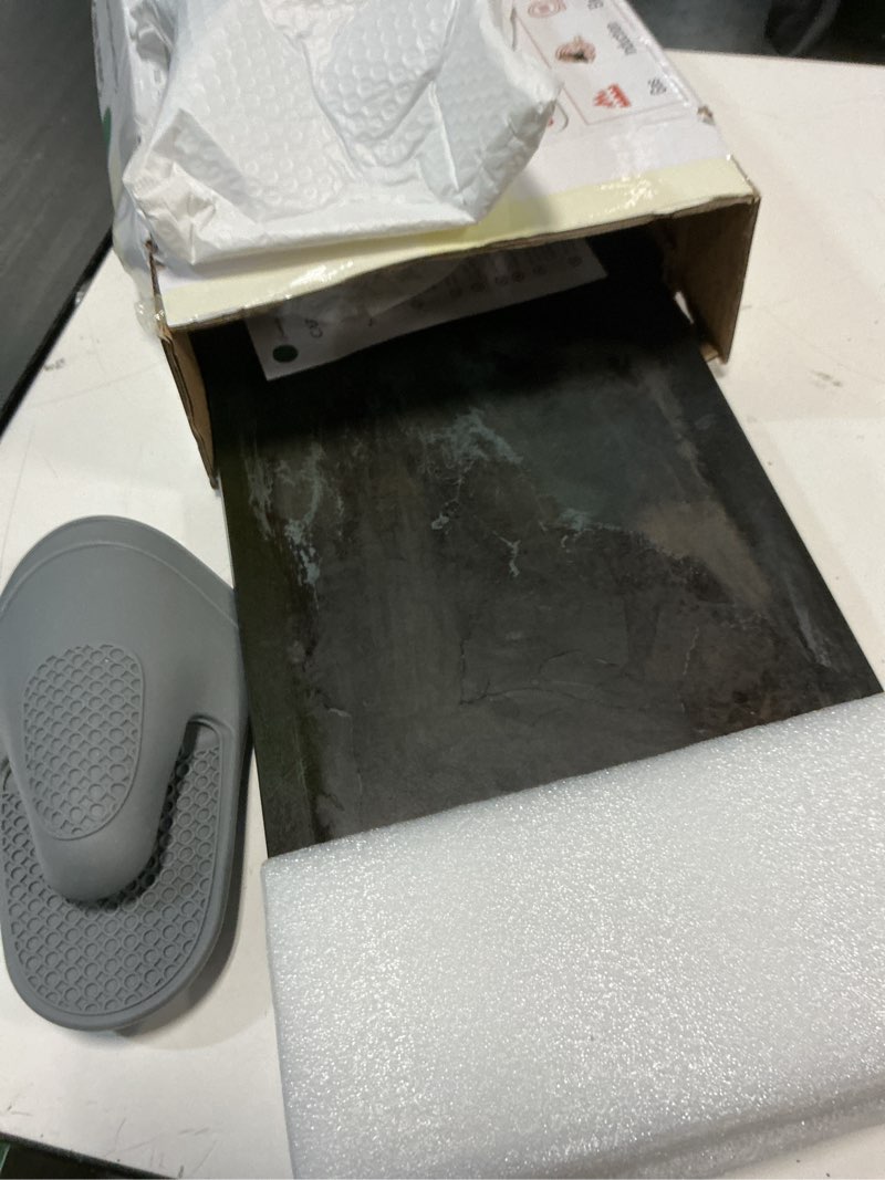 Condition photo showing As Is for carbon steel griddle comes with grill press, double burner griddle for gas stove, electric range, outdoor gas grill, induction, and oven, pre-seasoned nitride coating compatible with made in