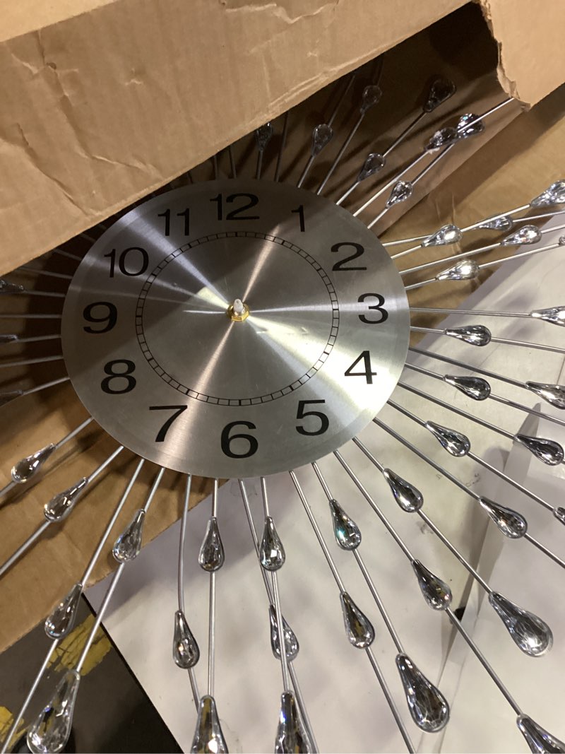 Condition photo showing As Is for FLEBLE Modern Large Wall Clocks for Living Room Decor Big Silent Wall Clocks Battery Operated Quartz for Bedroom Office Kitchen House Metal 24 Inch Silver Round Clock Wall Decorative for Home Indoor Silver 24inch