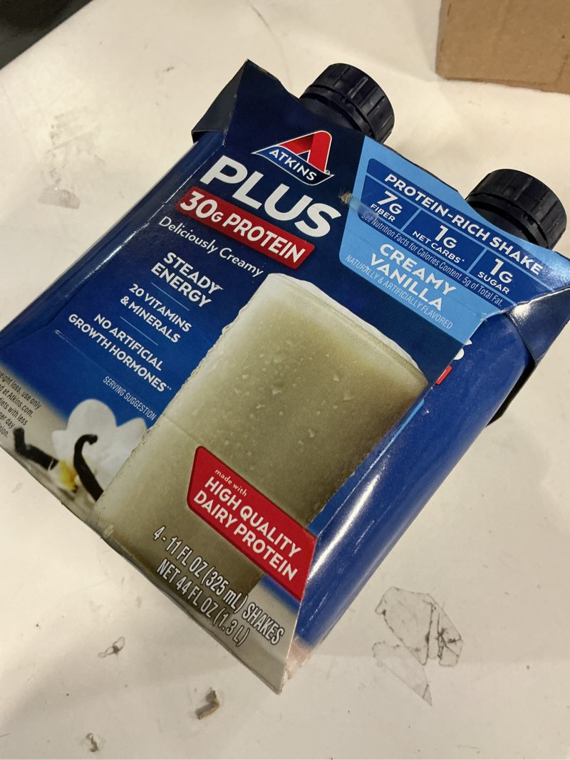 Condition photo showing New/Like New for (ENJOY BY:04/04/26)Atkins - Rtd Plus Protein & Fiber Shakes Creamy Vanilla 12  Pack 182968