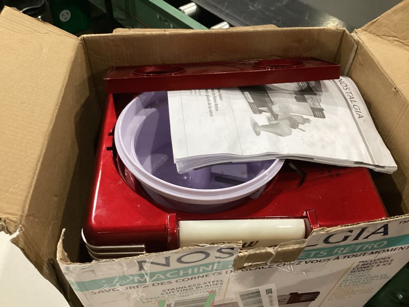 Condition photo showing As Is for nostalgia snow cone maker tabletop shaved ice machine with 2 reusable cones & ice scoop  red