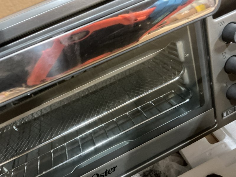 Condition photo showing As Is for Oster 10 Function Air Fryer Oven Toaster Oven Countertop NEW Model