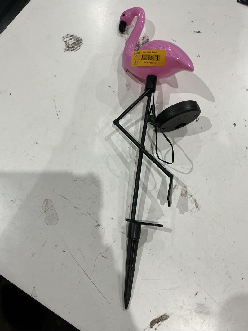 Condition photo showing As Is for   harbor breeze flamingo pink solar led outdoor path light with dusk-to-dawn sensor 5900-k