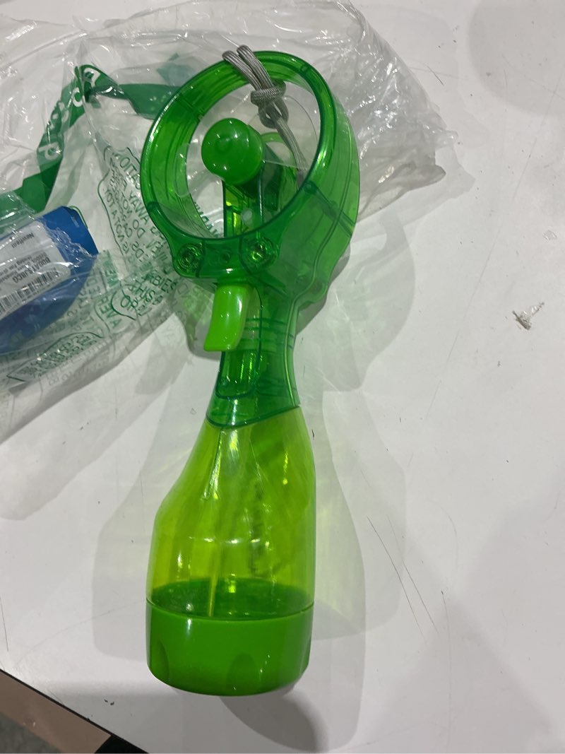 Condition photo showing As Is for o2cool deluxe handheld misting fan battery powered green | yes green single