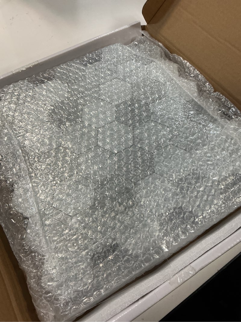 Condition photo showing As Is for The Tiles Plaza 10-Sheet Peel and Stick Backsplash, Carrara White Hexagon Stone Composite Marble Looks Self Adhesive Wall Tile, Stick On Tiles for Kitchen Bathroom Shower, Cover 9 Sq Ft. Carrara White 11.3" x 11.4"