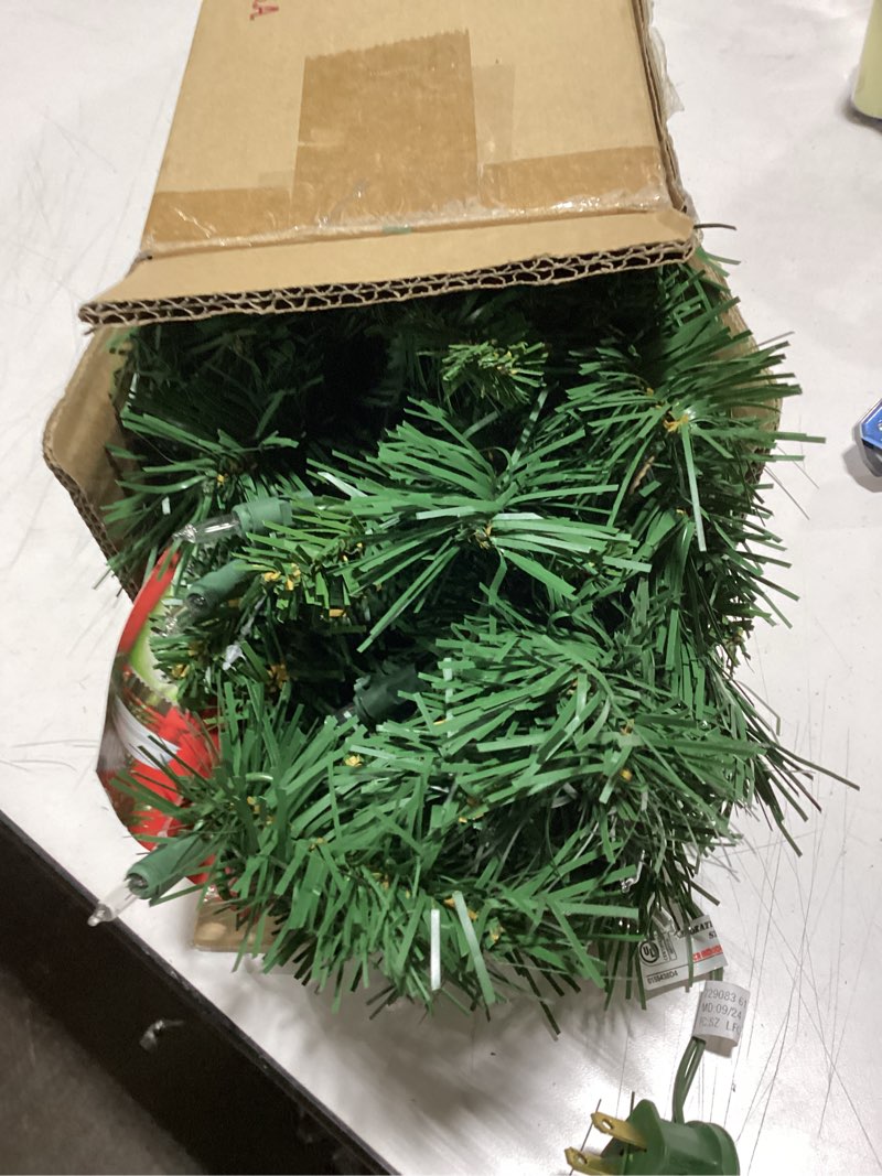 Condition photo showing Good Condition for National Tree Company 24 in Pre-Lit Majestic Fir Mini Artificial Christmas Tree, 35 Clear Lights, 71 Tips, Red Cloth Base, Green Plug in w/Red Bag Tree