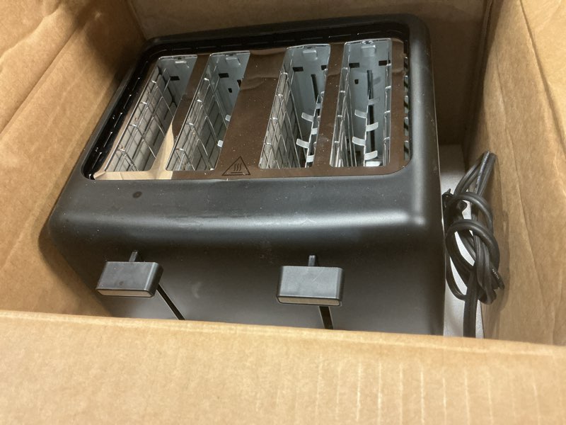 Condition photo showing As Is for amazon basics 4 slice toaster, with 7 browning settings, extra wide slots for bagels and special breads, removable easy-to-clean crumb trays, cancel/defrost/bagel buttons, 1500w, black & silver