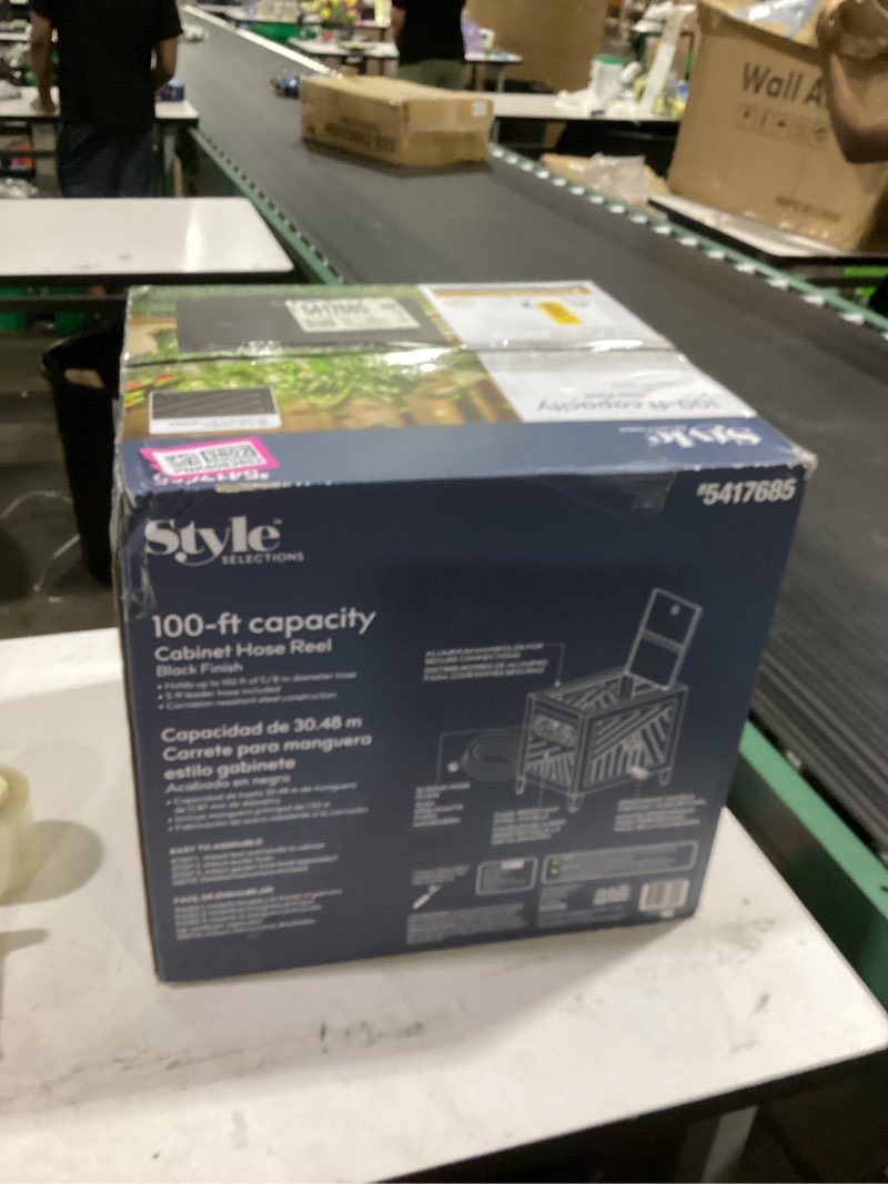 Condition photo showing New/Like New for ames neverleak hose reel cabinet box, 100 ft. capacity, decorative with wicker look, auto track rewinding, black metal