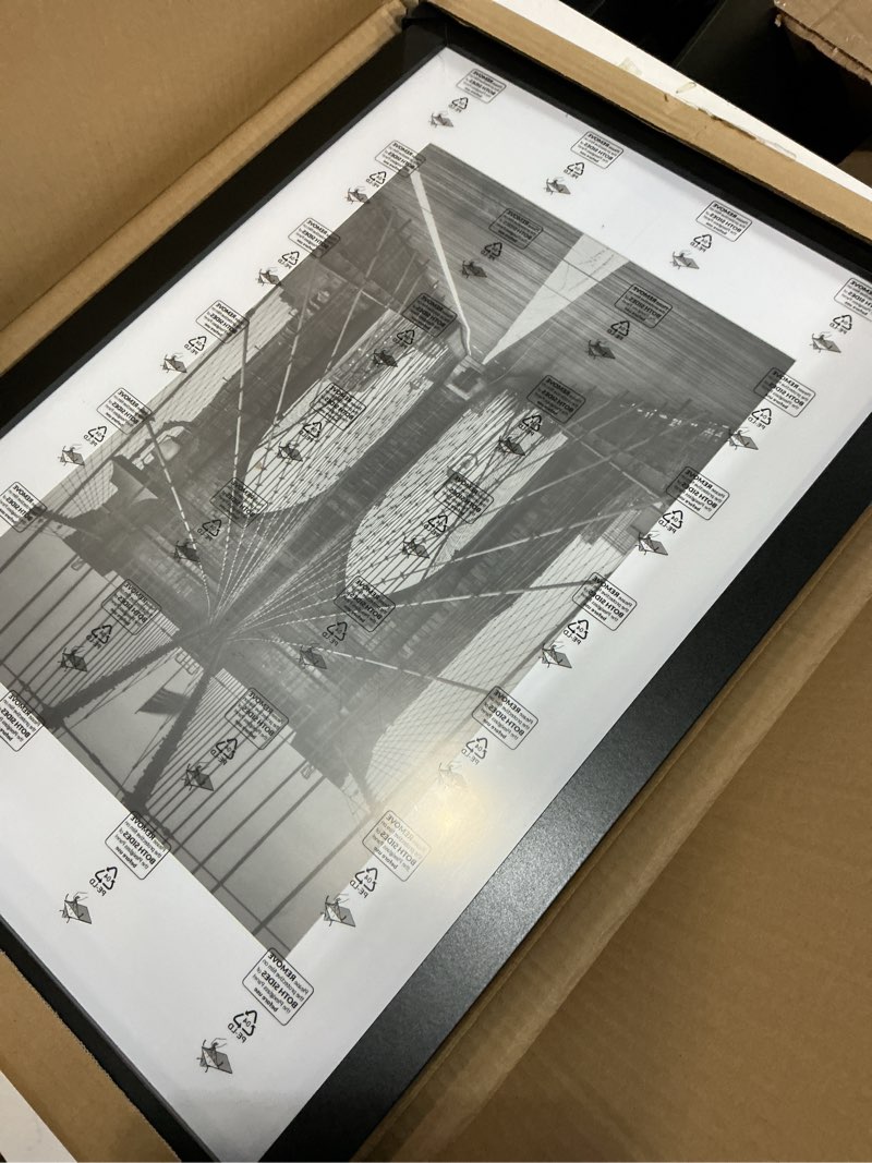 Condition photo showing Good Condition for LaVie Home 16 x 24 Picture Frame Black Poster Frame,Display Pictures 12x18 with Mat or 16x24 Without Mat, Stable and Sturdy Frame and Polished Plexiglass, Suitable for wall decoration?1 Pack? 16x24 Black