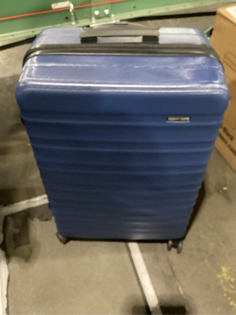 Condition photo showing New/Like New for amazon basics 30" hardside large checked luggage, hardshell suitcase with wheels, expandable for up to 15% more space, with scratch-resistant surface, four multi-directional wheels, navy blue navy blue large checked