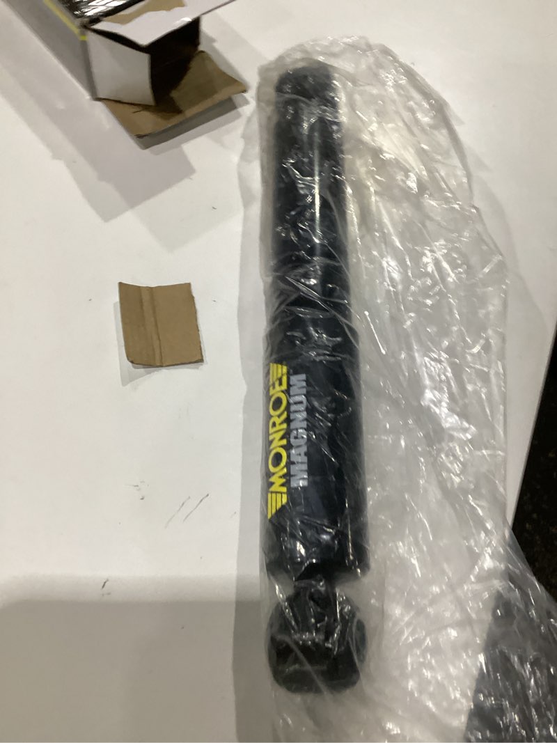 Condition photo showing As Is for monroe shocks & struts magnum 66627 shock absorber