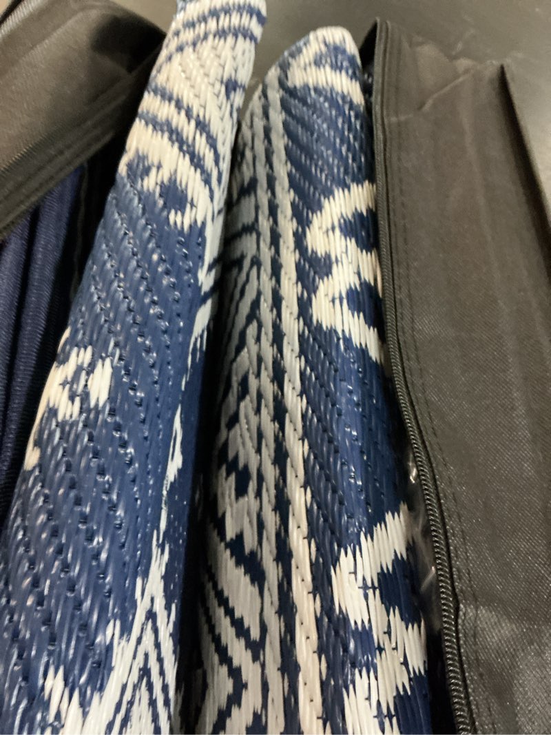 Condition photo showing Good Condition for olanly outdoor rug waterproof 5x8 ft, reversible outdoor plastic straw rug, boho patio rug, indoor outdoor carpet, rv mat outside for patio, camp, picnic, balcony, deck, backyard, blue & white