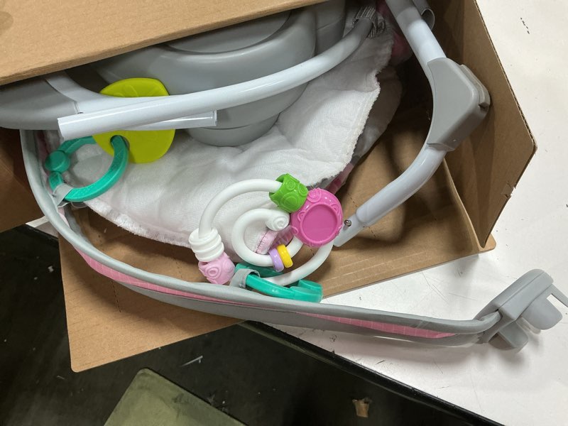 Condition photo showing As Is for bright starts pink paradise portable compact automatic baby swing with music, unisex, newborn +