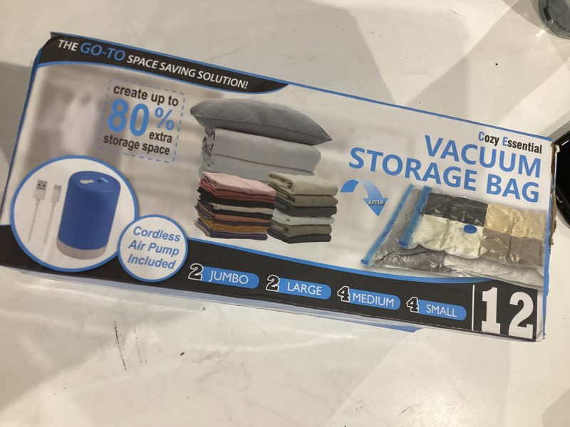 Condition photo showing Good Condition for cozy essential 12 pack travel vacuum storage bags with rechargeable wireless electric pump for luggage, suitcase, carry-on size vacuum seal compression space saver bags for clothes and clothing travel 12 pack-e