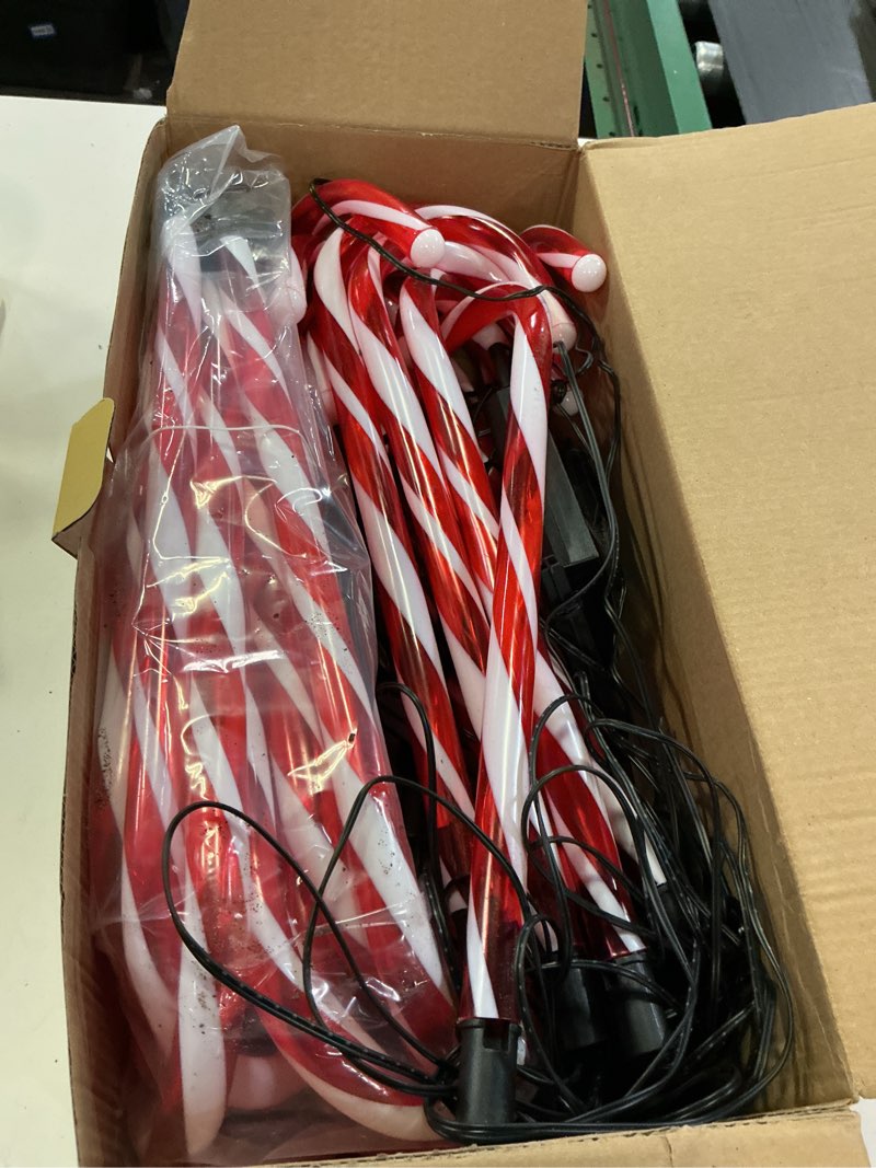 Condition photo showing As Is for Upgraded 24 Pack Candy Cane Solar Christmas Lights Waterproof, Rechargeable Pathway Lights with Remote, Solar Powered & USB Charging Christmas Decorations Outdoor for Garden Lawn Yard Party Warm White 24 Pack(Solar)
