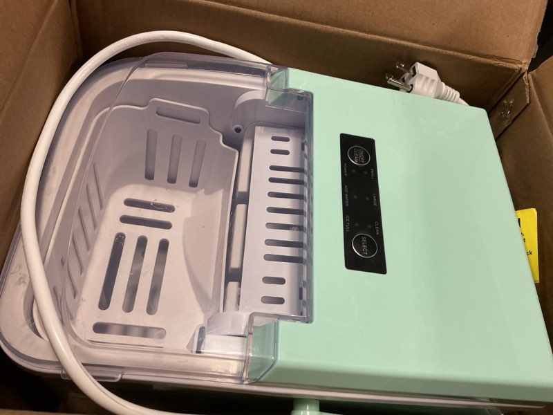 Condition photo showing As Is for NEWBULIG Ice Makers Countertop with Handle, Portable Ice Machine, 9 Bullet Ice Cubes in 6 Mins, 26lbs in 24Hrs, Auto-Cleaning, with Basket and Scoop, for Home, Kitchen, RV, Camping, Green Green Handle 12.5"*11.6"*8.8"