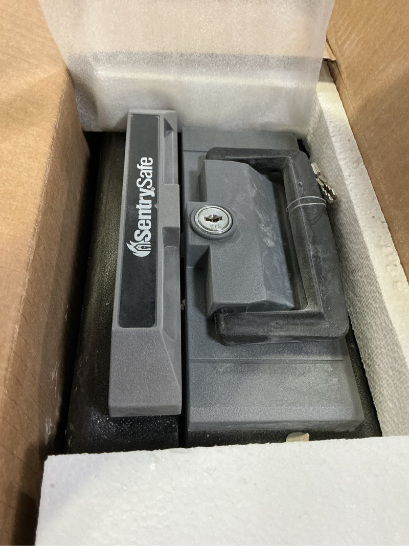 Condition photo showing As Is for SentrySafe Fireproof Safe Box with Key Lock, Chest Safe with Carrying Handle to Secure Money, Jewelry, Documents, 0.25 Cubic Feet, 6.3 x 15.3 x 12.1 Inches, 1160 Fire resistant box 0.25 cu. ft.