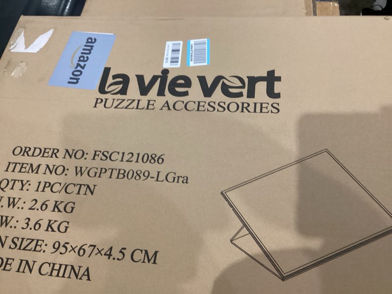 Condition photo showing New/Like New for Lavievert 1500 Piece Tilting Puzzle Board with 2-in-1 Stand & Cover, Adjustable Felt Mat Plateau with 6 Colored Sorting Trays, Lightweight Portable Jigsaw Puzzle Table with Non-Slip Surface for Adults