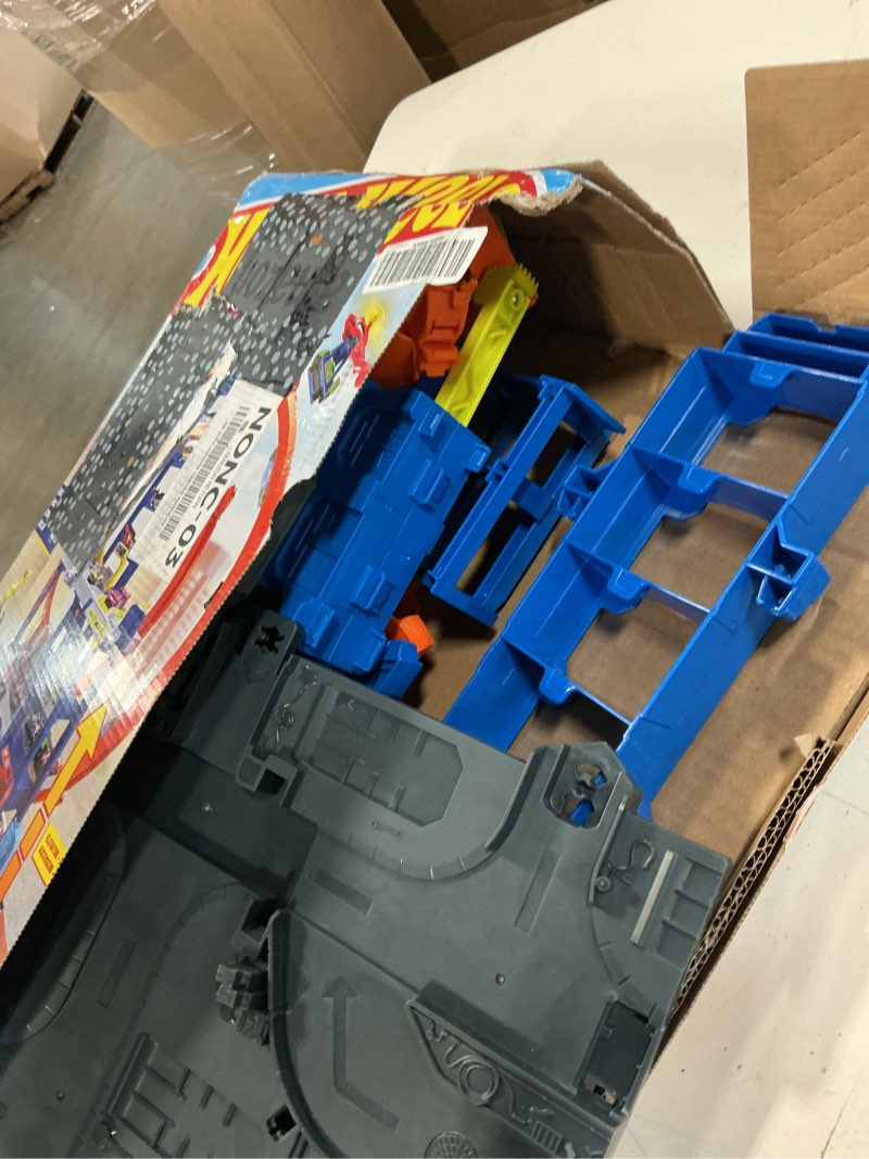 Condition photo showing Good Condition for hot wheels toy car track set with die-cast car & helicopter, 2 loops, storage for 36 1:64 scale vehicles, speed snap adapters, mega loop garage