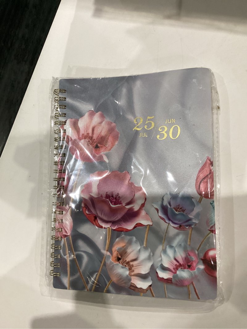 Condition photo showing New/Like New for 2026-2031 Monthly Planner - 5 Year Planner/Calendar, 5 Year Planner 2026-2031, Spiral Bound, Jul. 2026 - Jun. 2031, 6.4" x 8.5" Planners with Tabs, 60 Month Calendar, Two-Side Pocket - Pink Flower