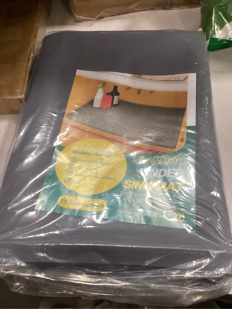 Condition photo showing New/Like New for Jin&Bao Waterproof Under Sink Mat 34x22 for Kitchen and Bathroom, Thicken Cabinet Protector and Kitchen Shelf Liner, Organizer and Storage, Multipurpose Mat for Pets, Coffee Area, and Shoe Entryway 22"W x 34"L Dark Gray
