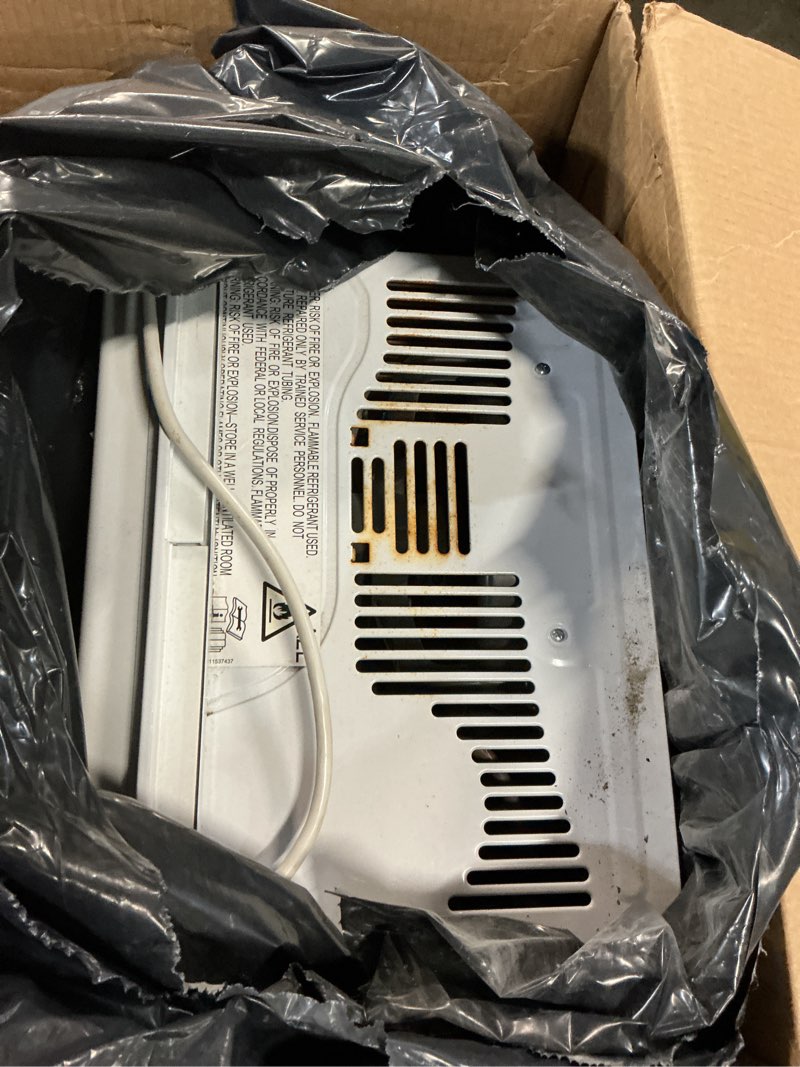 Condition photo showing As Is for ge 6,000 btu electronic window air conditioner, cools rooms up to 250 sq ft, digital controls with remote, energy saver mode, 24hr timer, easy install kit included, white new 6,000 btu electronic controls white