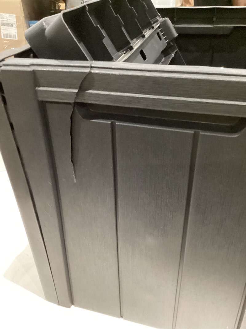 Condition photo showing As Is for gallon outdoor resin deck box, waterproof storage box with lockable lid & side handles, black