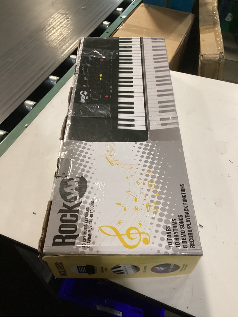 Condition photo showing New/Like New for rockjam 49 key keyboard piano,sheet music stand, piano note stickers & simply piano lessons black