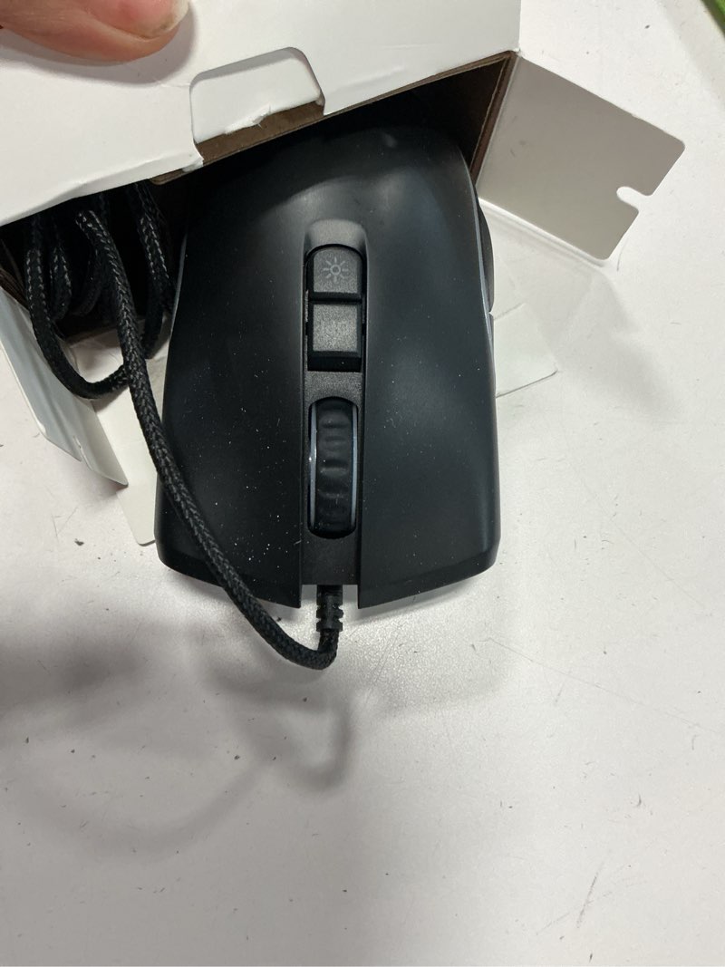 Condition photo showing As Is for onn. gaming mouse with rgb lighting and 7 programmable buttons  adjustable dpi from 200-7200  6ft cable