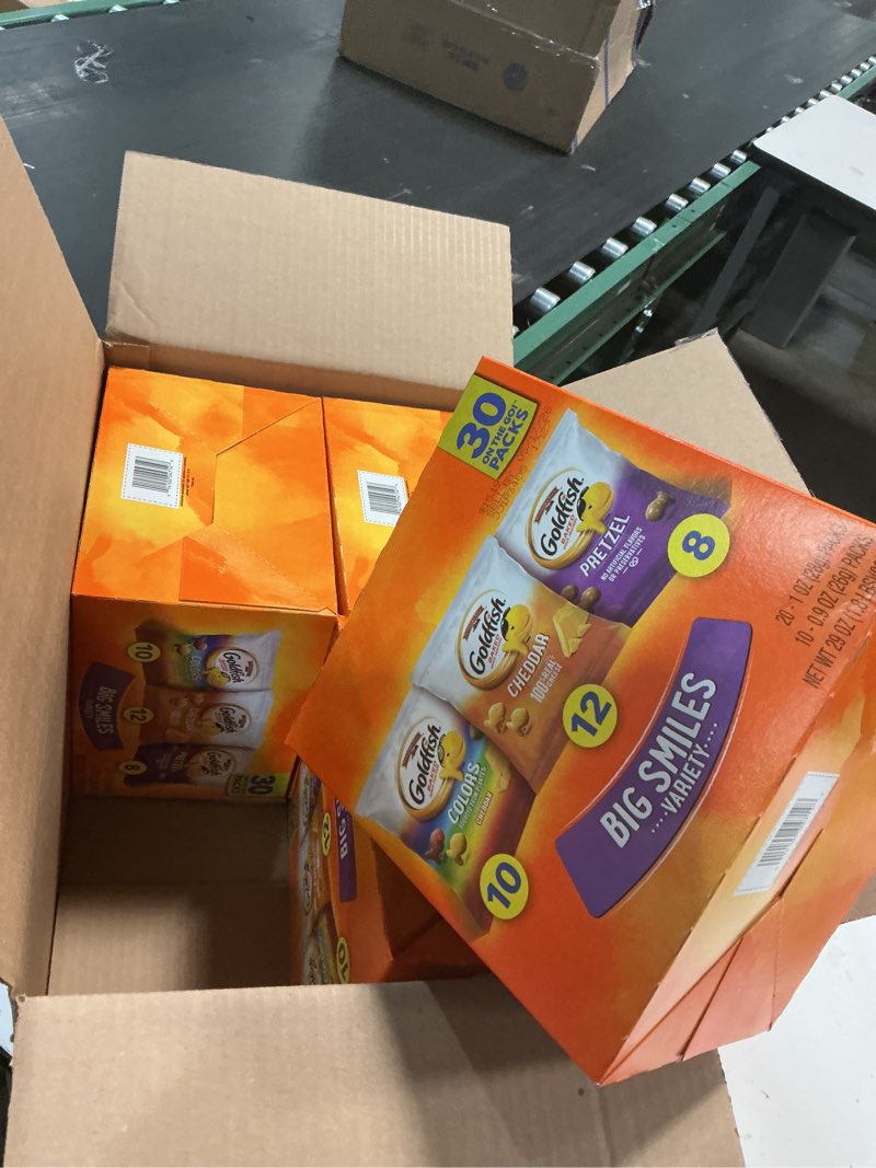 Condition photo showing New/Like New for sell by date 05/17/26 4 packs of 30 count packs goldfish crackers big smiles variety pack with cheddar, colors, and pretzels, snack packs, 30 ct variety 29 ounce (pack of 4)l