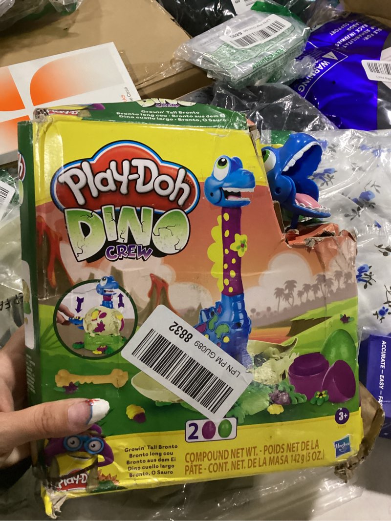 Condition photo showing As Is for play-doh dino crew growin' tall bronto toy dinosaur for kids 3 years and up with 2 eggs, 2.5 ounces each, non-toxic standard packaging