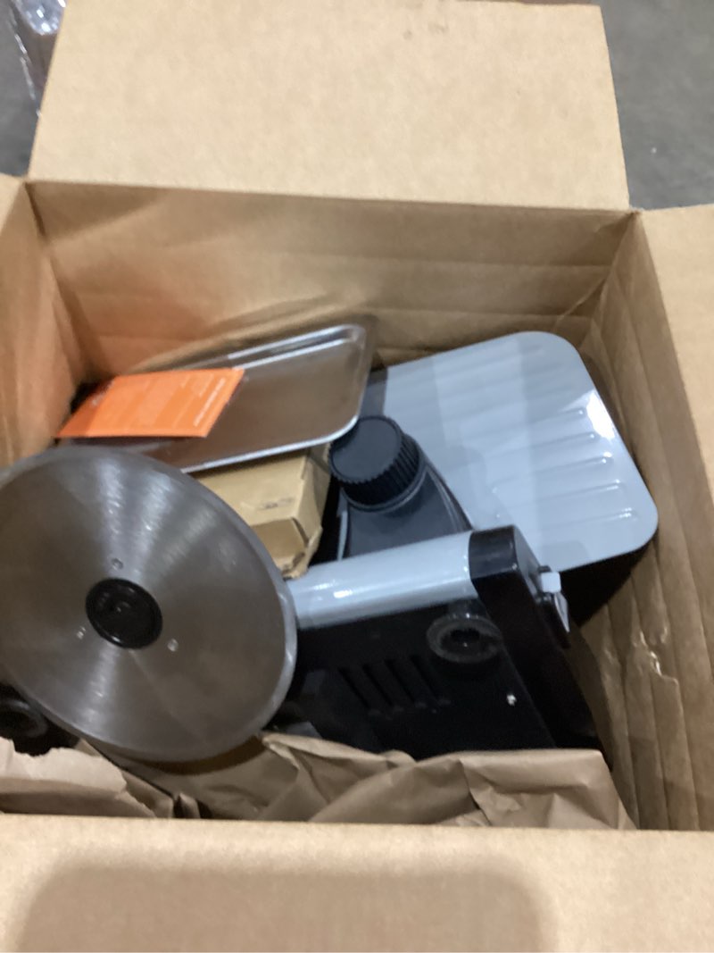 Condition photo showing As Is for meat slicer 200w electric deli food slicer with 2 removable 7.5" stainless steel blade, adjustable thickness for home use, child lock protection, easy to clean, cuts meat, bread and cheese 200w meat slicer with 2 blades