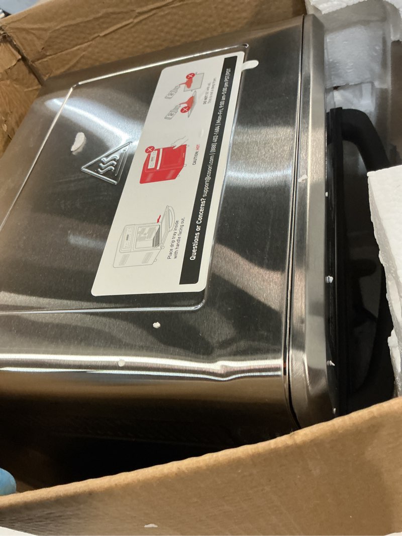 Condition photo showing As Is for cosori air fryer toaster oven, 13 qt fits 4 lbs chicken, 11-in-1 functions for small kitchen countertop, with rotisserie, dehydrate, bake, roast, reheat, in app recipes & 6 accessories, silver