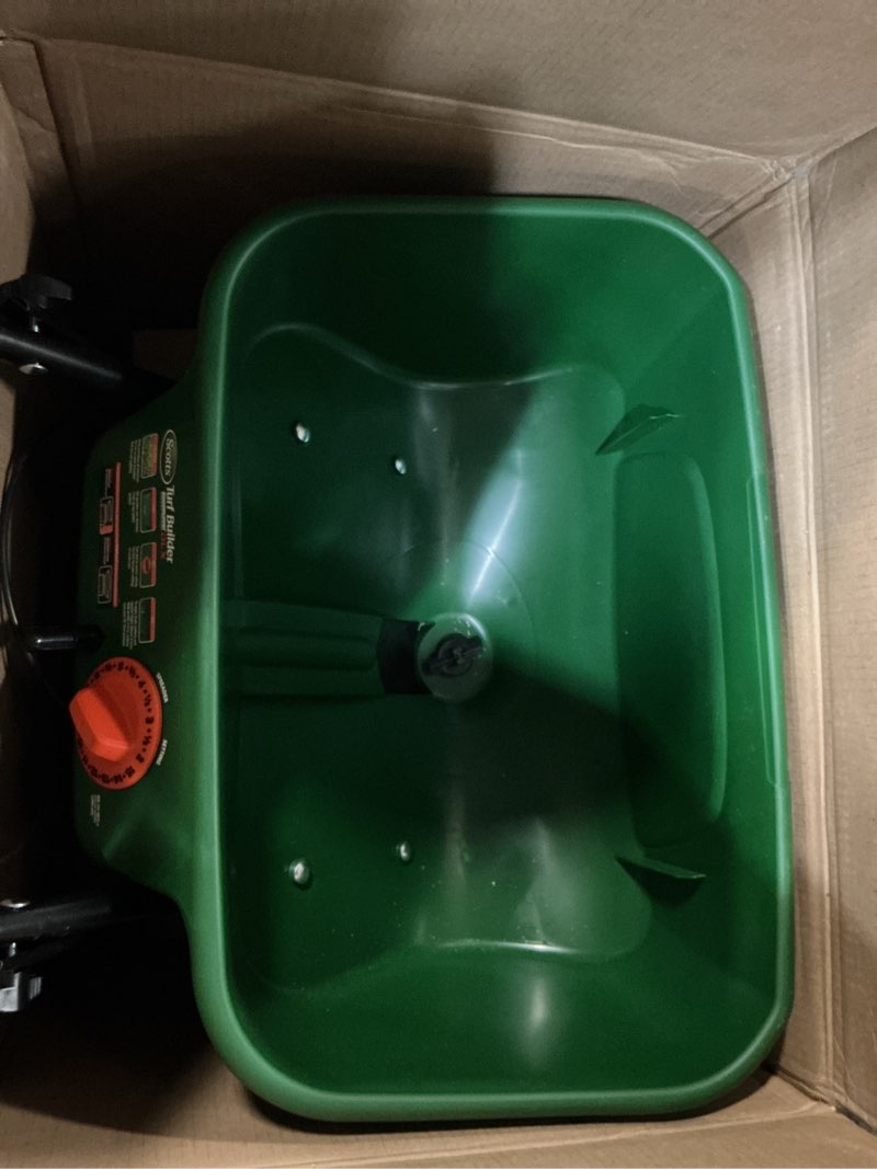 Condition photo showing Good Condition for scotts turf builder edgeguard dlx broadcast spreader - spreader for lawn fertilizer, weed & insect control, grass seed, and ice melt, holds up to 15,000 sq. ft. of product