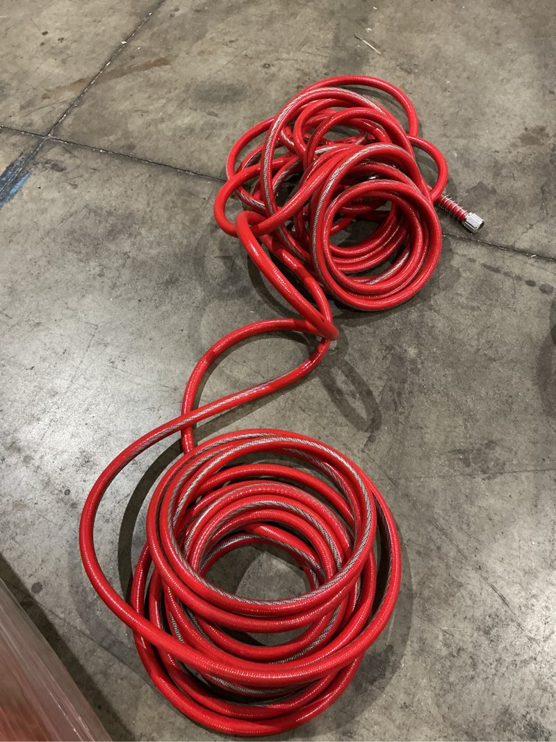 Condition photo showing As Is for kink control contractor grade hose with high burst strength, spring coil and crush resistant couplings