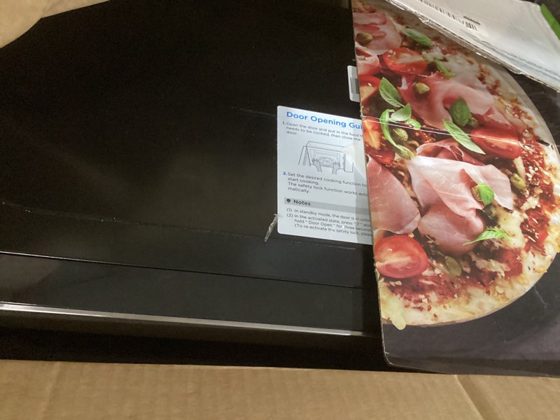 Condition photo showing As Is for Farberware 0.7 Cu. Ft. Countertop Microwave Oven – 700 Watts Power, Auto Cook Settings, Defrost, Easy Clean and Child Safety Lock - Stainless 0.7 Cu. Ft Stainless Steel
