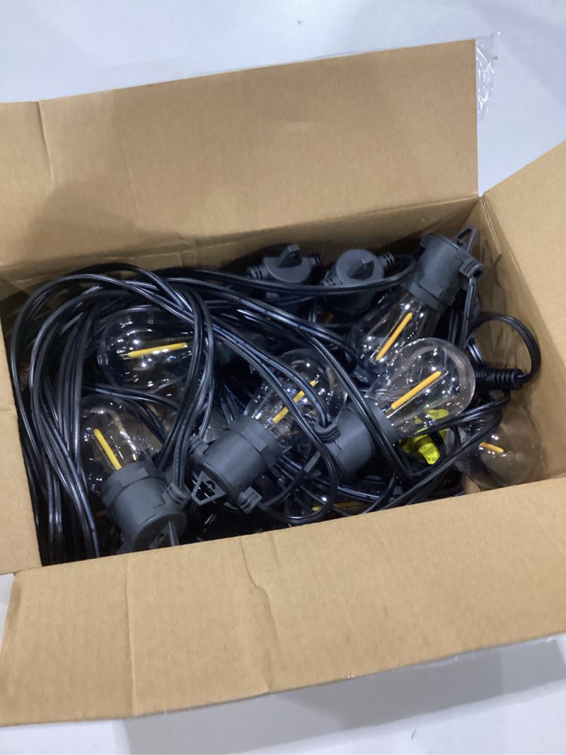 Condition photo showing As Is for addlon 50ft led outdoor string lights with edison shatterproof bulbs, weatherproof strand, commercial grade patio lights, decorative for garden or patio, black