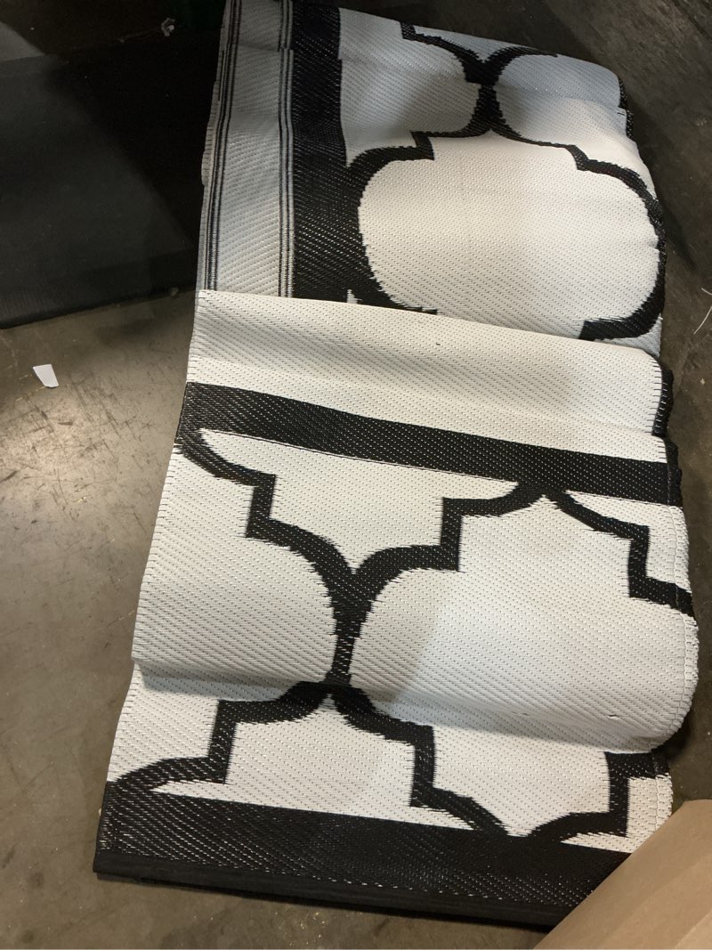 Condition photo showing Good Condition for genimo 8 ' x 10 ' outdoor rug for patio clearance, waterproof indoor outdoor plastic straw rugs carpet, reversible outside area rv mat for camping, balcony porch, deck, picnic, beach (black & white) black&white 8' x 10' (rectangular)