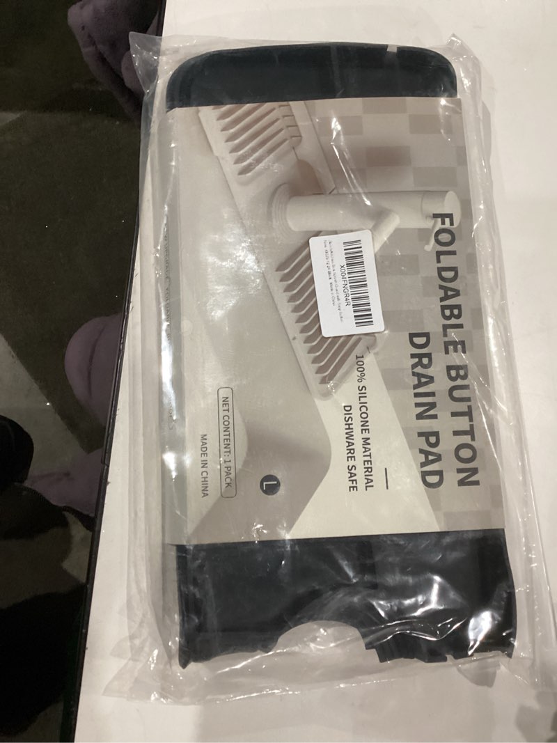 Condition photo showing New/Like New for koureik 24 inch faucet mat for kitchen sink, 6° slope sink splash guard with fasten button lock,foldable silicone faucet guard & draining mat for kitchen bathroom sink area, black 24" x 5.5" black