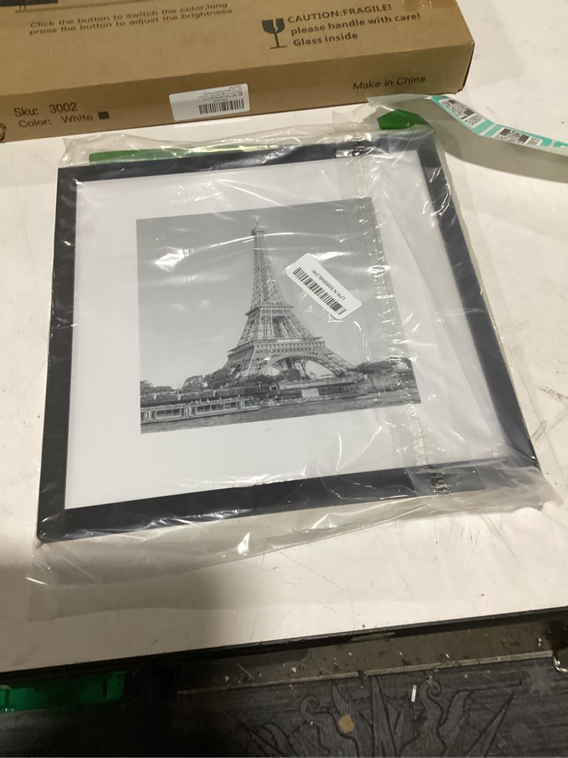 Condition photo showing New/Like New for upsimples 12x12 picture frame, display pictures 8x8 with mat or 12x12 without mat, wall hanging photo frame, black, 1 pack black 12x12