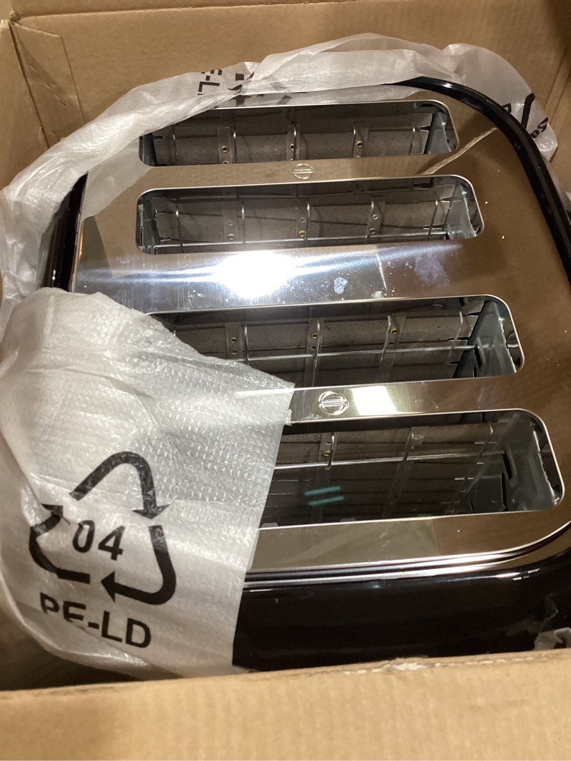Condition photo showing Good Condition for BLACK+DECKER 4-Slice Toaster, Extra Wide Slots, 7 Shade Settings, 1400 Watts, Frozen and Bagel Buttons, Toast Shade Selector, Extra Lift 4-Slice Black