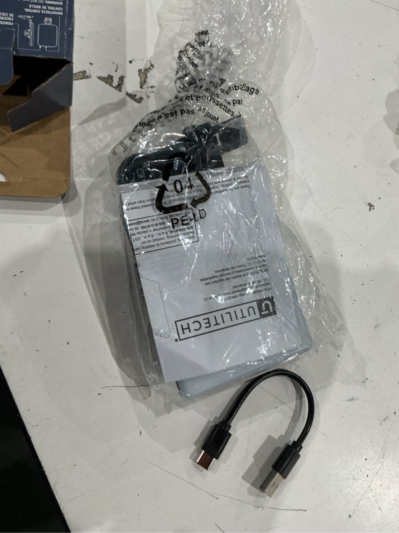 Condition photo showing As Is for utilitech rechargeable clip-on led light for phone tablet or laptop-