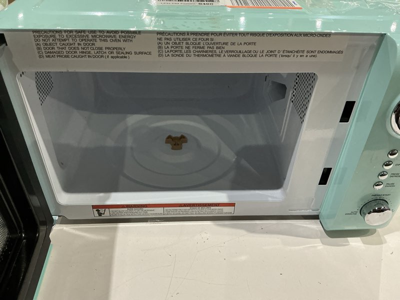Condition photo showing As Is for nostalgia countertop microwave oven with easy clean interior - retro microwave with led display & child lock- compact 0.7 cu. ft. oven with 12 pre-programmed settings for quick cooking- 700-watts-aqua retro classic 0.7 cu. ft. aqua
