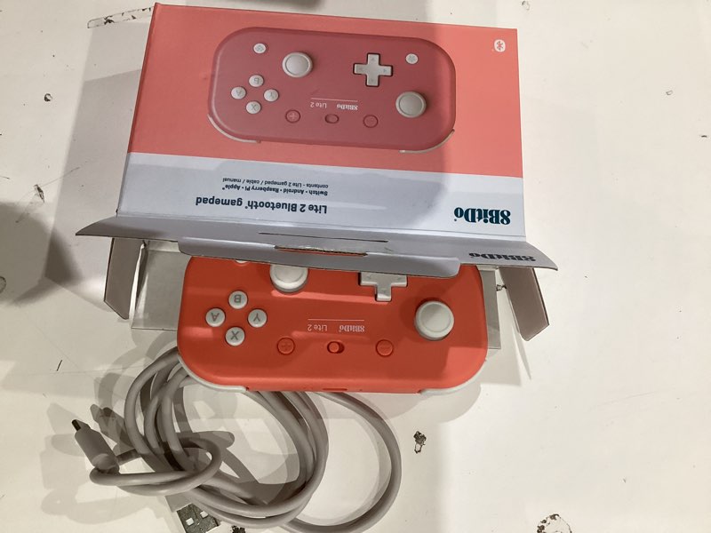 Condition photo showing Good Condition for 8bitdo lite 2 bluetooth controller with motion controls, linear motors vibration, joysticks, triggers and d-pad, wireless gamepad for switch/switch 2, android & raspberry pi (pink)