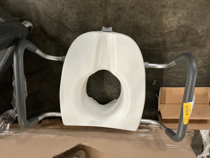 Condition photo showing As Is for locking elevated toilet seat with arms 11"- 14" long,white