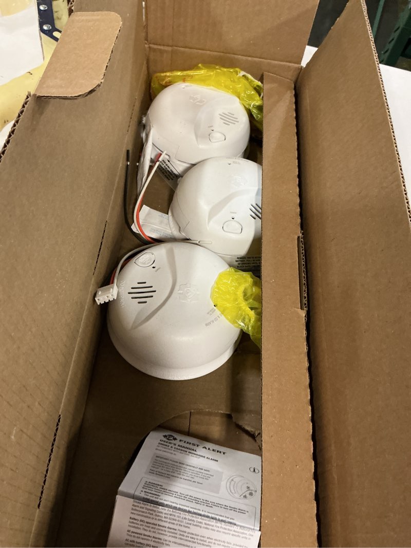 Condition photo showing As Is for first alert smico100-ac interconnect hardwire combination smoke & carbon monoxide alarm with battery backup - 3 pack