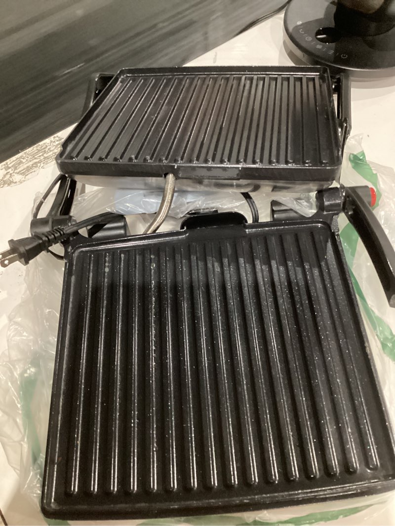 Condition photo showing As Is for chefman panini press grill and gourmet sandwich maker non-stick coated plates, opens 180 degrees to fit any type or size of food, stainless steel surface and removable drip tray, 4 slice, black 4 slice - standard