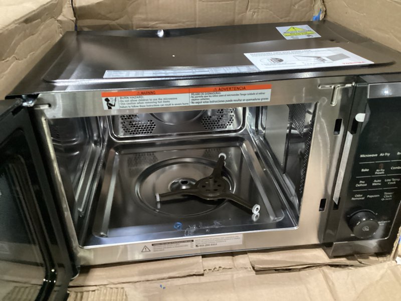 Condition photo showing As Is for (USED, NOT TESTED, DAMAGED) TOSHIBA Air Fryer Combo 8-in-1 Countertop Microwave Oven, with Convection, Broil, Odor Removal Mode, 12.4\" Position Memory Turntable, Child-Lock, 1.0 Cu.ft, Black Stainless Steel, ML2-EC10SA(BS)